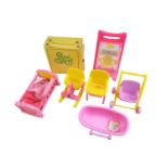 A 1970s Sweet April Carry Case Wardrobe doll set together with a group of accessories, including a