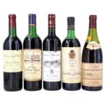 Five bottles of red wine, including Chateau La Rose Figear 1972, Castillo Ducay 1982, Baron de