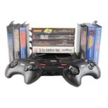 A SEGA Megadrive II video game console together with controllers, a quantity of games including