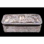 An Edwardian silver and cut glass dressing table box, the lid repoussé decorated with adorsed