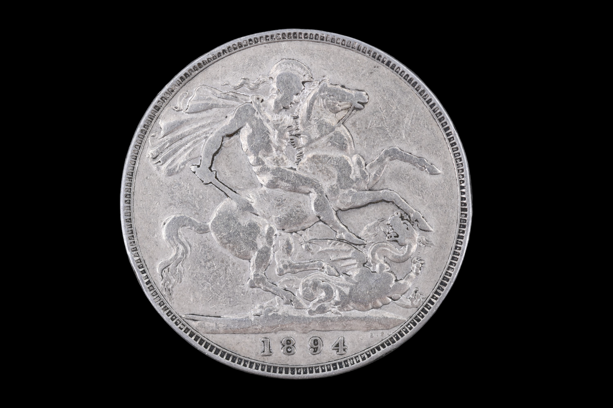 An 1894 silver crown coin