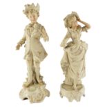 A pair of Belle Epoque figurines of performers in fancy 18th Century style costume, tallest 32 cm