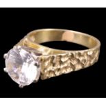 A 1960s 18 ct yellow metal solitaire ring, the 2 carat white quartz in a six prong white metal
