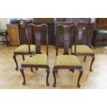 A set of four 1930s Queen Anne mahogany stand chairs, having carved backsplats, 106 cm high