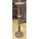 A contemporary pine stand, having a spiral reeded column with two collars, 97.5 cm high