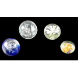 Four late 20th Century glass paperweights, including a faceted controlled bubble example, 8.5 cm