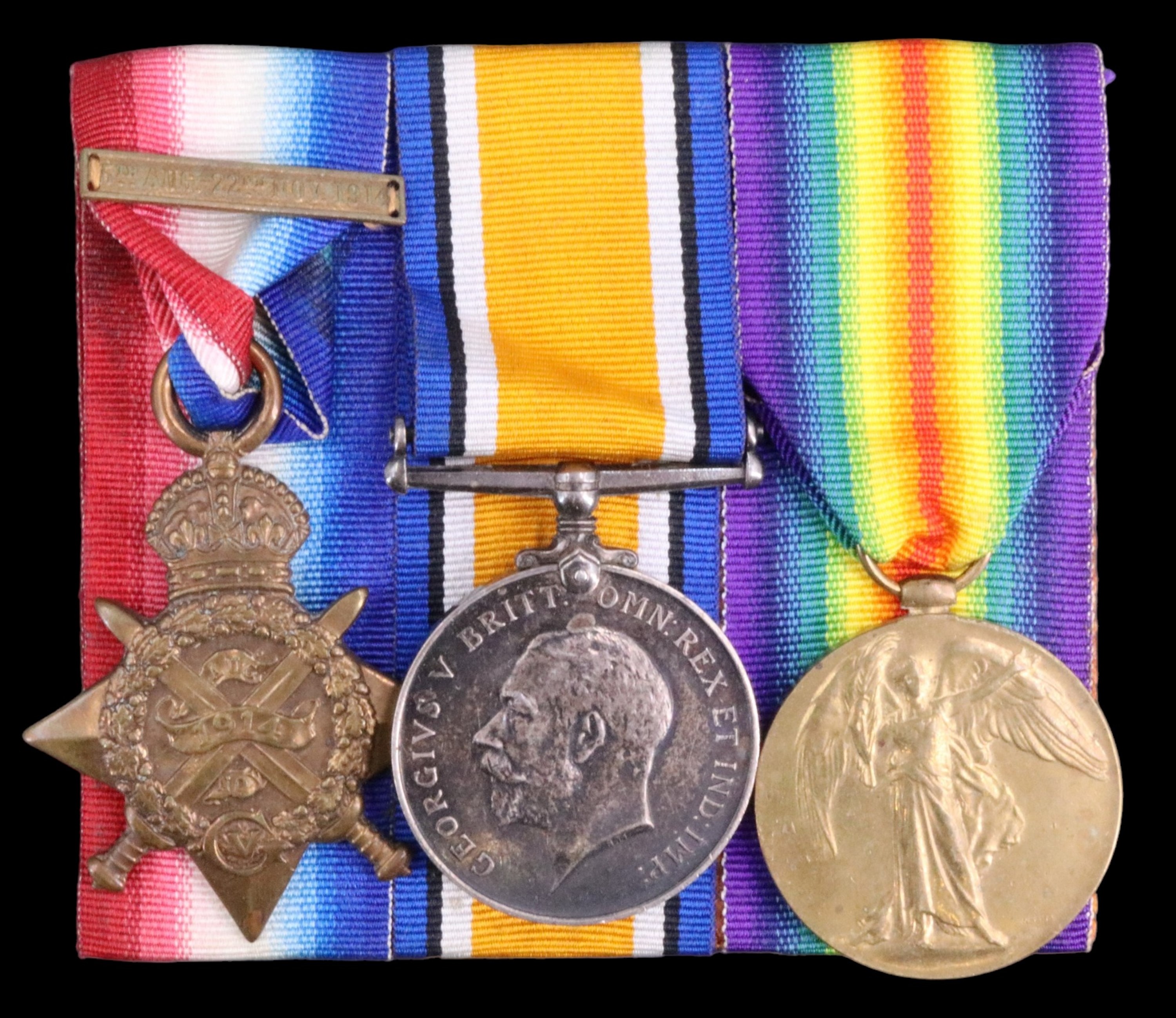 A 1914 Star with clasp, British War and Victory Medals to 7876 Pte E E Moore, 2 Border Regiment