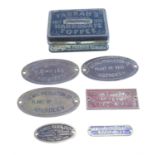 A Farrah's toffee tin and manufacturer's brass plaques
