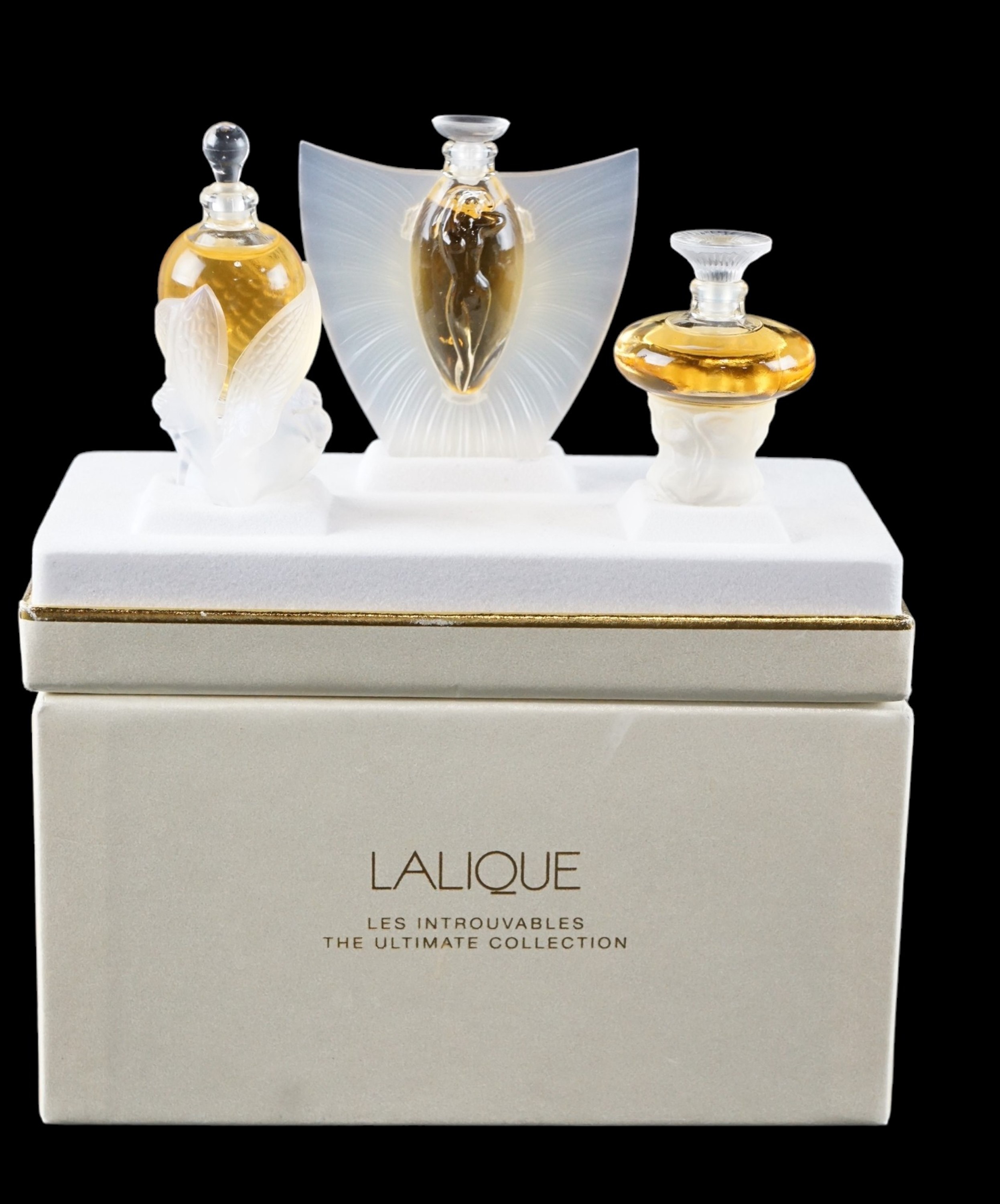Lalique Parfums "Les Flacons Collection Miniatures" three piece glass bottled perfume set,