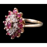 An early 20th Century ruby and diamond cluster ring, having a marquis cut ruby above a surrounding