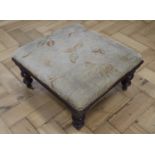 An early 20th Century upholstered footstool, having turned legs, 37 x 35 x 19 cm
