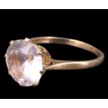 An imposing white sapphire solitaire ring, the 4.5 carat brilliant set on a gallery of adorsed