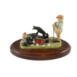 A Peter Miles figurine Henry Brewis and Sepp the dog, 13.5 cm