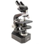 A Nikon binocular microscope, having phase contrast, four objectives and a vernier slide-holder,