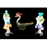 Two Murano studio glass clowns together with a bird figurine, tallest 23 cm