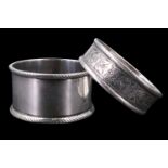 Two silver napkin rings, one bearing engraved floral decoration, 27 g