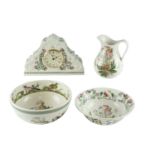 Three items of Portmeirion The Botanic Garden ware, comprising a mantle clock, a jug and a bowl,