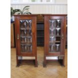 A pair of Edwardian mahogany cabinets, the doors having convex leaded glazing, each 39.5 x 22 x 89