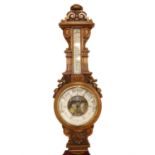 A carved oak aneroid barometer by James Dowell, Carlisle, 85.5 x 28 cm