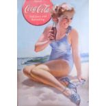 A framed reproduction Coca-Cola advertising poster, 76 cm x 56 cm