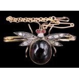 An early 20th Century diamond and almandine flying beetle brooch, having an 11 x 9.5 mm garnet