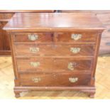 A George III walnut banded mahogany chest of two over three drawers, having fluted quarter