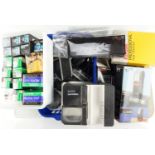 A large quantity of photographic equipment including filters, film, flashes, etc