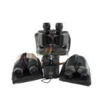 A set of vintage binocular field glasses together with three contemporary pairs of binoculars