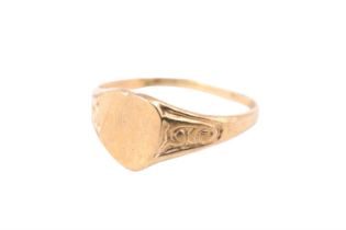 A vintage child's 9 ct gold yellow metal signet ring, having a vacant heart shaped matrix, marked
