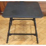 A square topped ebonised occasional table, the underside stamped 'Gregory