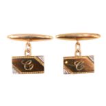 A pair of diamond and 9 ct yellow metal cufflinks, each having an oblong front with opposing corners