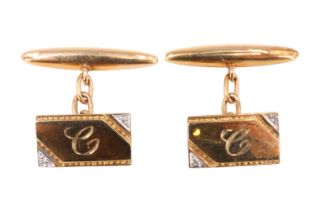 A pair of diamond and 9 ct yellow metal cufflinks, each having an oblong front with opposing corners