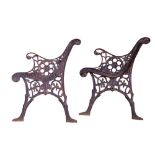 A pair of late 20th Century cast iron bench ends, 74 cm high