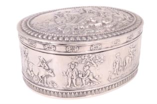 An early 20th Century silver trinket box, of oblate form the hinged lid repoussé decorated with a