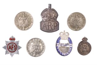 Silver ARP and Royal Army Reserve badges together with an Auxiliary Fire Service and Civil Defence
