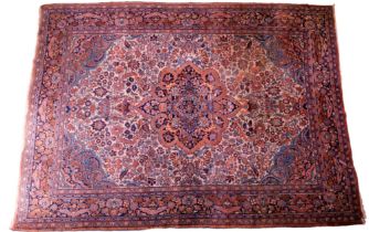 A large hand-knotted Persian Mashad rug, 350 x 260 cm