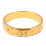 A 22 ct gold wedding band, of oblong section having engraved decoration, London, 1959, 3.86 g,