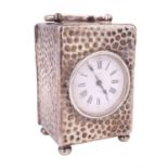 An Edwardian silver cased diminutive boudoir clock, having a French lever escapement movement and