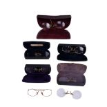 Seven pairs of vintage gold plated pince-nez reading glasses