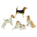 A Beswick Beagle together with four other dog figurines, former 19 cm