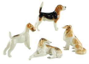 A Beswick Beagle together with four other dog figurines, former 19 cm