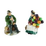 A boxed Royal Doulton figurine A Good Catch together with The Old Balloon Seller, former 18.5 cm