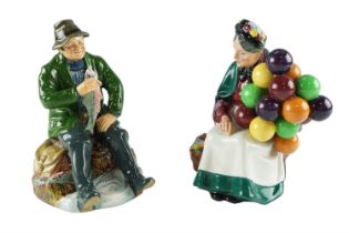 A boxed Royal Doulton figurine A Good Catch together with The Old Balloon Seller, former 18.5 cm
