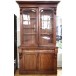 A William IV mahogany cabinet bookcase, having a frieze drawer over a two door cupboard, 122 x 107.5
