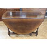 A late 20th Century Chapman's Siesta oak oval topped gate leg table, having turned legs and a drawer