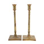 A pair of early 20th Century cast brass candlesticks, 29 cm