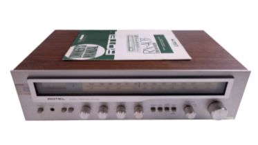 A Rotel RX-403 stereo AM/FM receiver, with owner's manual, 47 x 27.5 x 12 cm