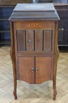 An early 20th Century marquetry inlaid mahogany floor-standing gramophone, bearing retailer's