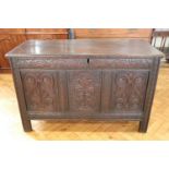 A 17th Century carved joined oak three panel coffer / kist, 125 x 59 x 78 cm