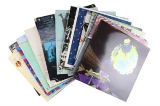 A group of LP vinyl records, including Genesis, Supertramp, Elton John, George Harrison, Paul